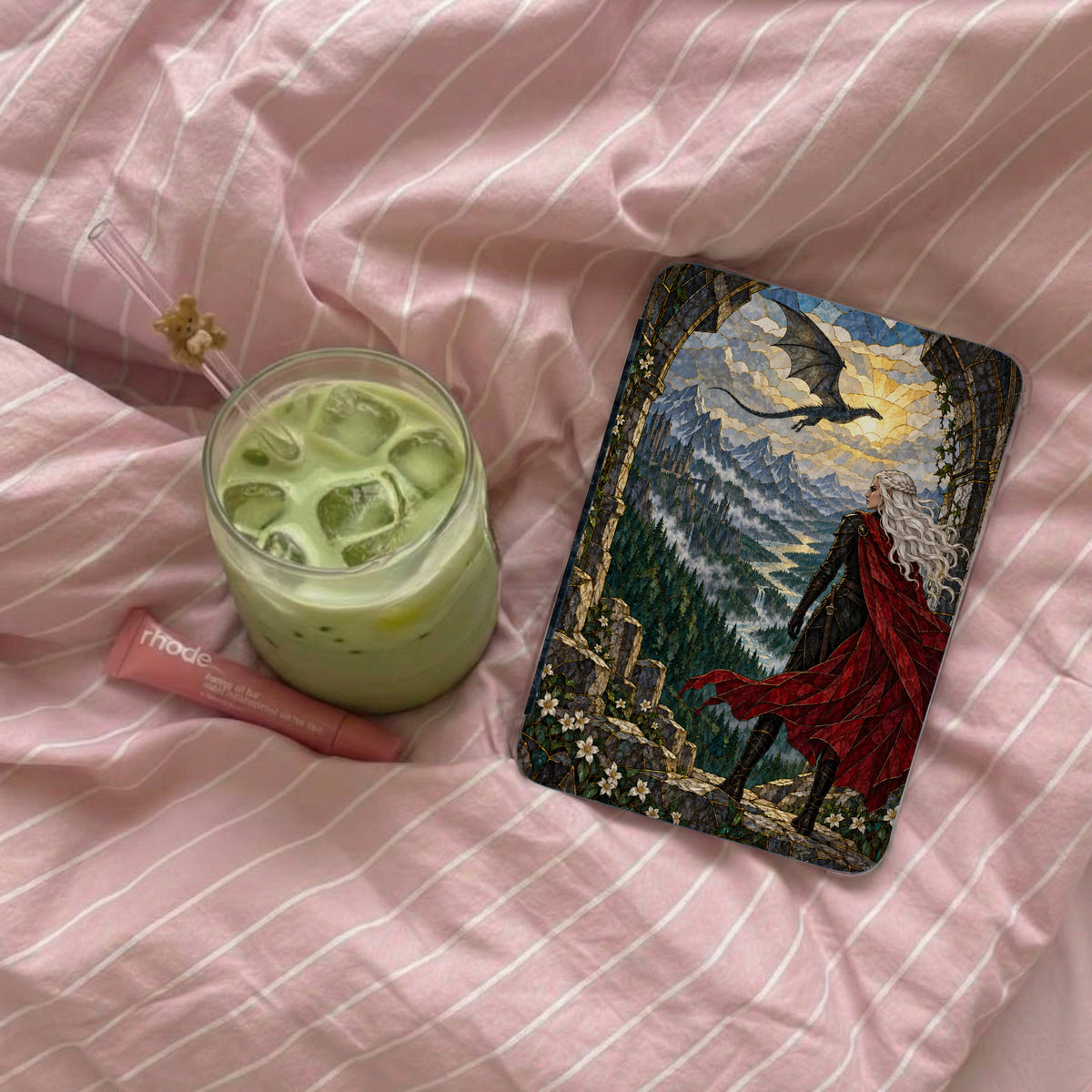 Book cover featuring woman with red cape, dragon, and mountain landscape.