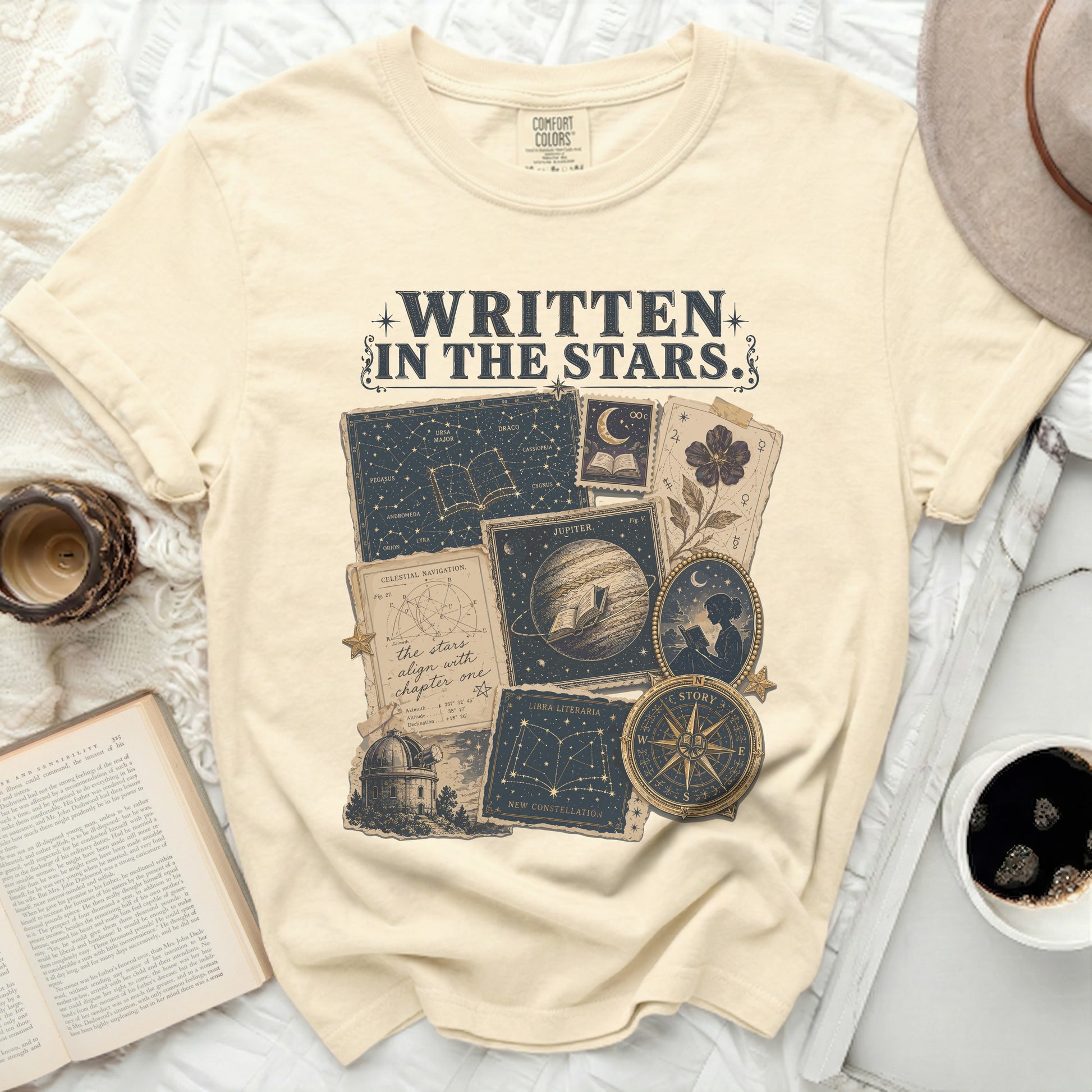 Cream t-shirt with celestial map and "Written in the Stars" text.