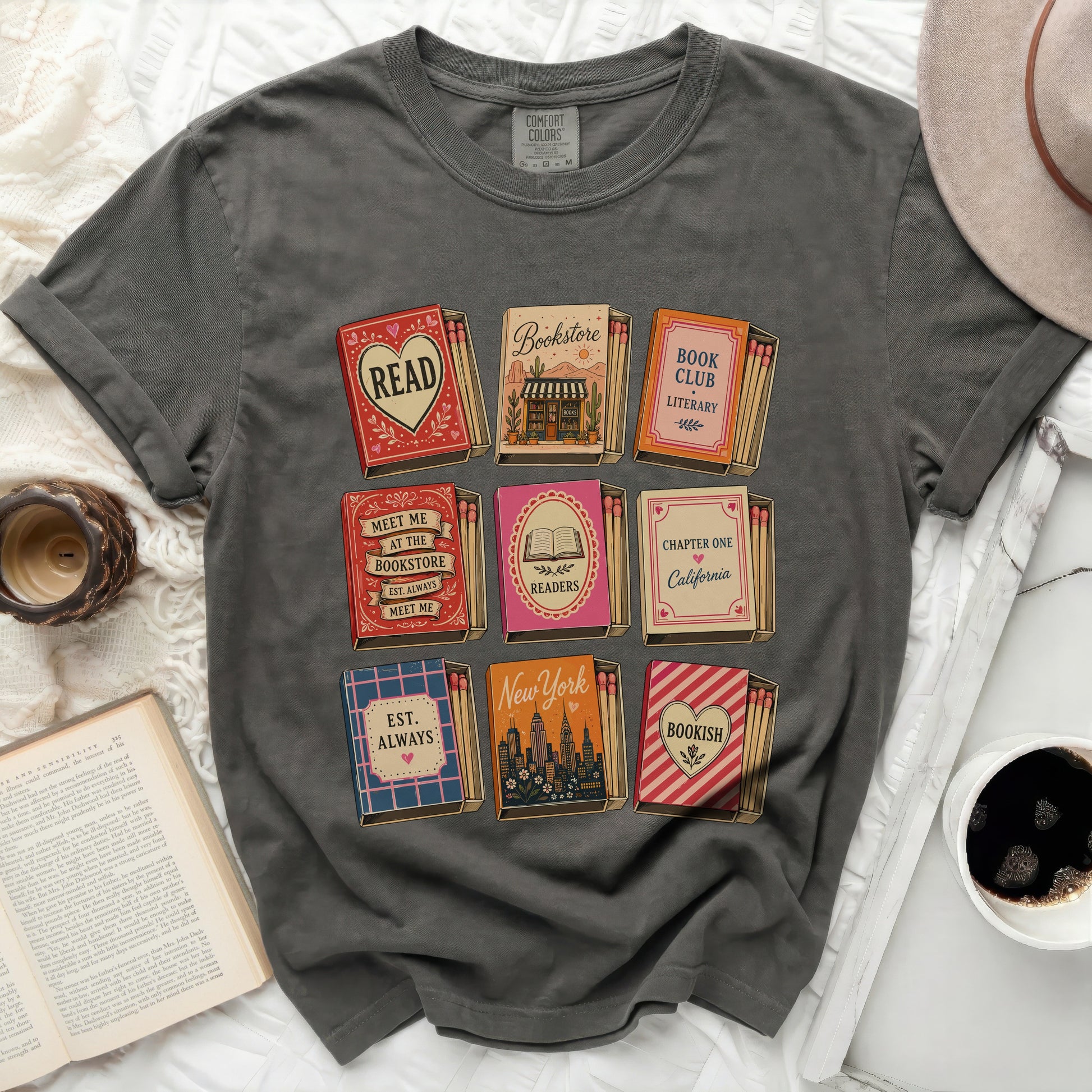 Graphic tee with nine matchbox designs featuring book-related words and phrases.