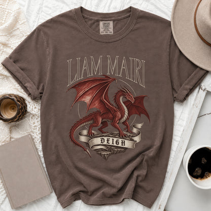 Brown t-shirt with red dragon design, text "LIAM MAIRI DEIGH".