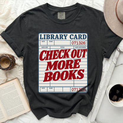Black t-shirt with "Library Card" graphic reading "Check Out More Books".