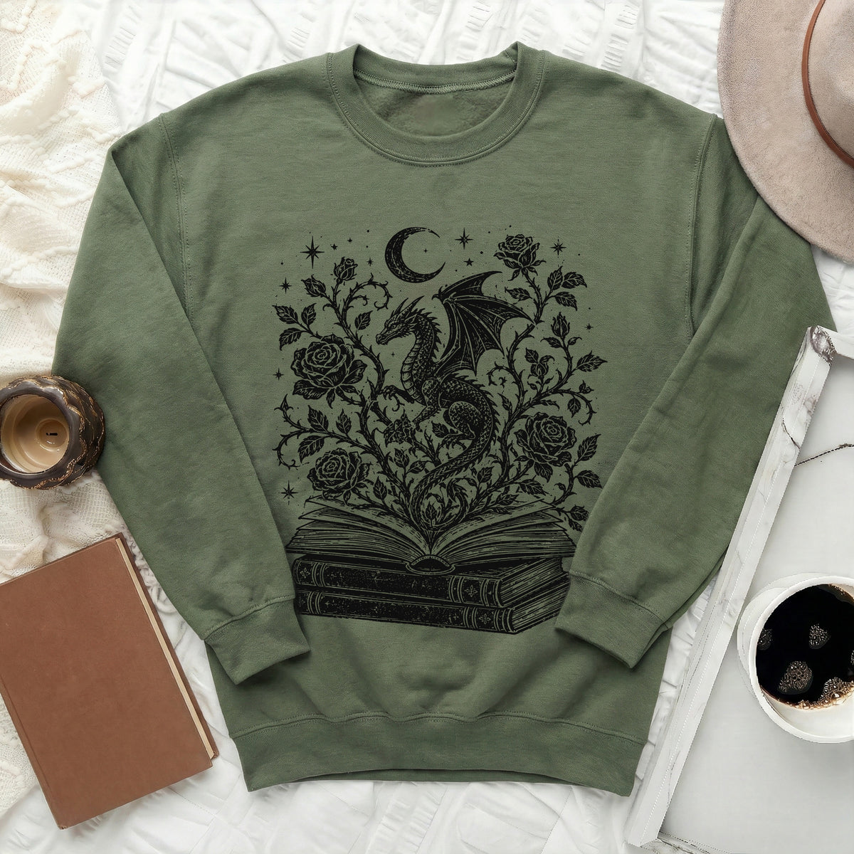 Green sweatshirt with black dragon, moon, roses, and book graphic design.
