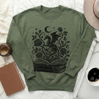 Green sweatshirt with black dragon, moon, roses, and book graphic design.
