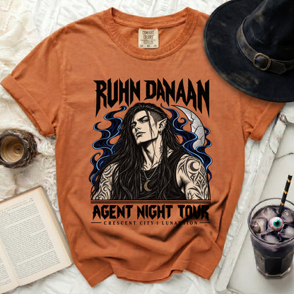 Orange t-shirt with "Ruhn Danaan Agent Night Tour" and crescent city artwork.