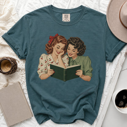 Vintage illustration of two women reading a book together, with Comfort Colors tag.