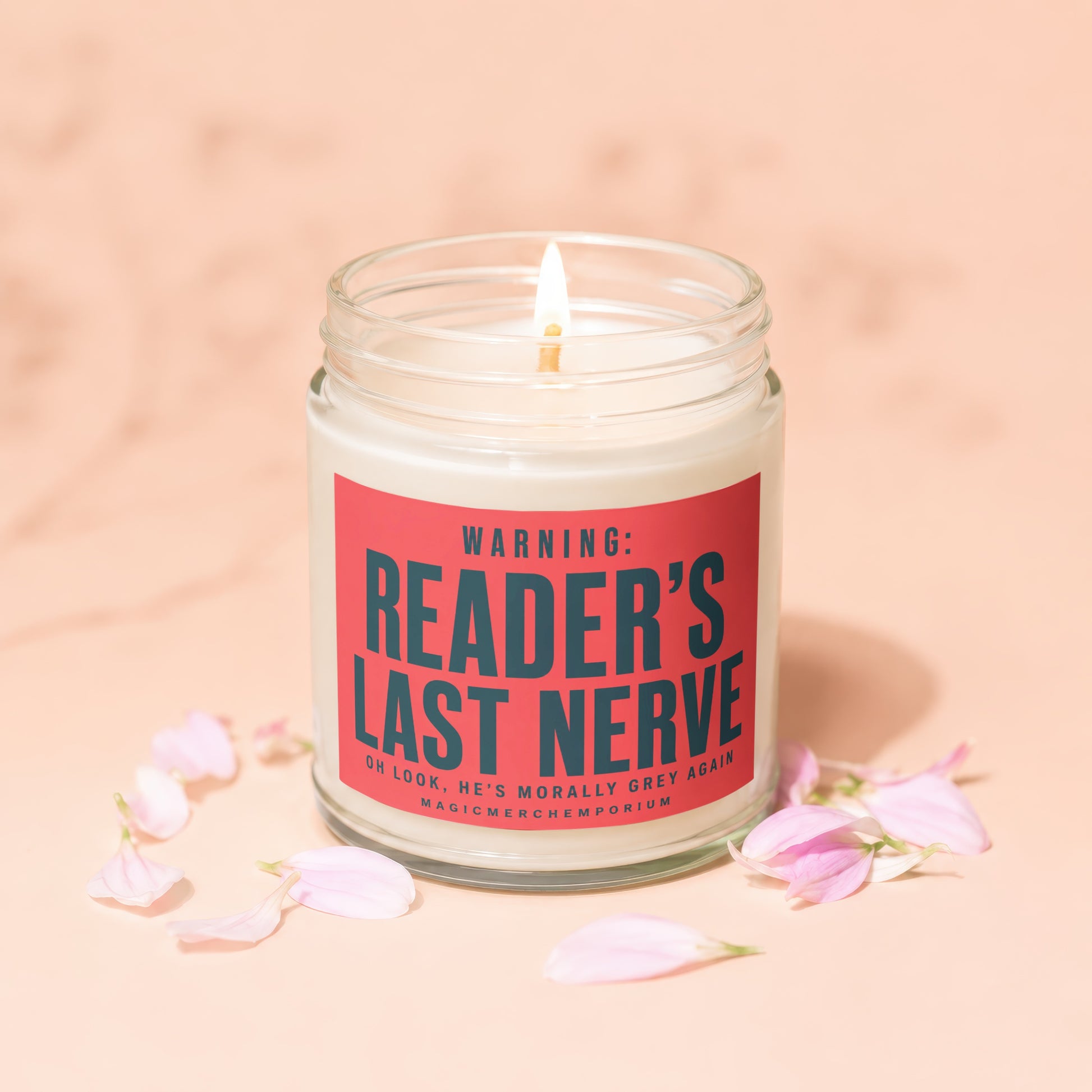 Jar candle with lit wick and red label reading "Reader's Last Nerve".