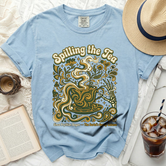 Light blue t-shirt with "Spilling the Tea" and floral design.