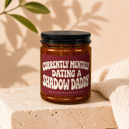 Amber jar candle with black lid, reads "Currently Mentally Dating a Shadow Daddy".