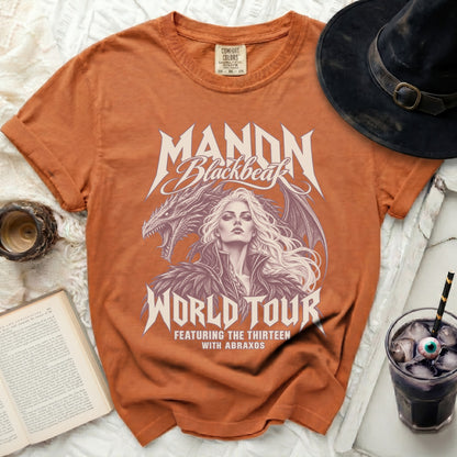 Orange t-shirt with Manon Blackbeak dragon and world tour graphic.