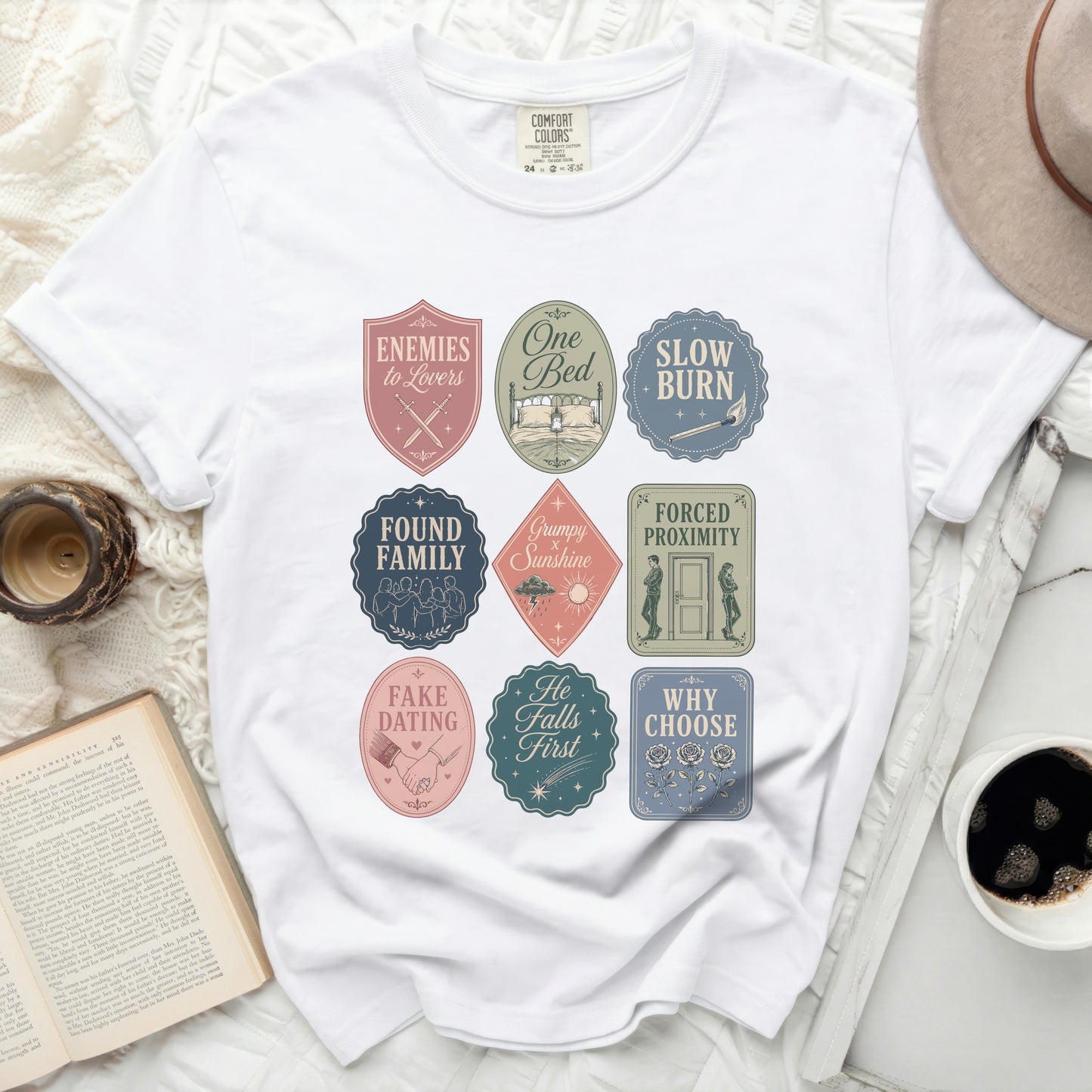 T-shirt with nine romance trope designs in shield and rectangular shapes.