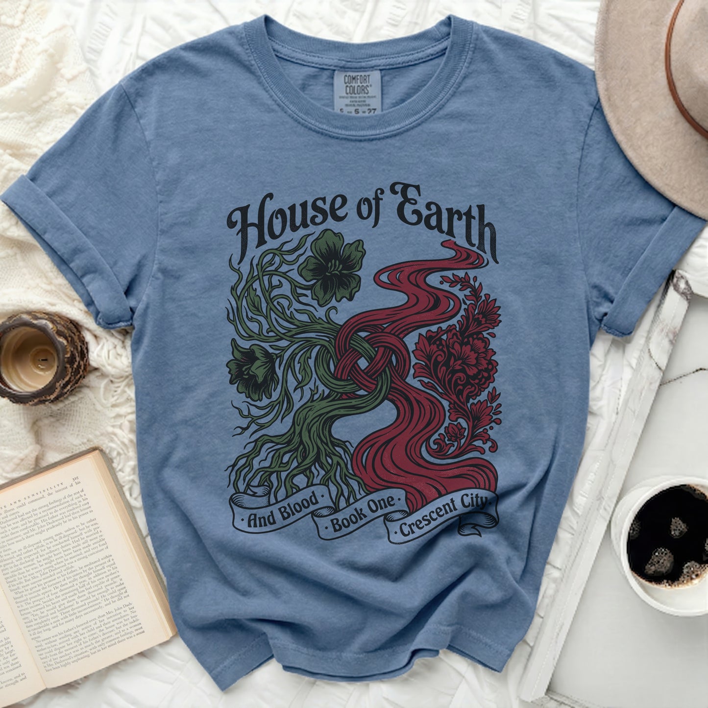 Blue t-shirt with "House of Earth and Blood Crescent City" design.