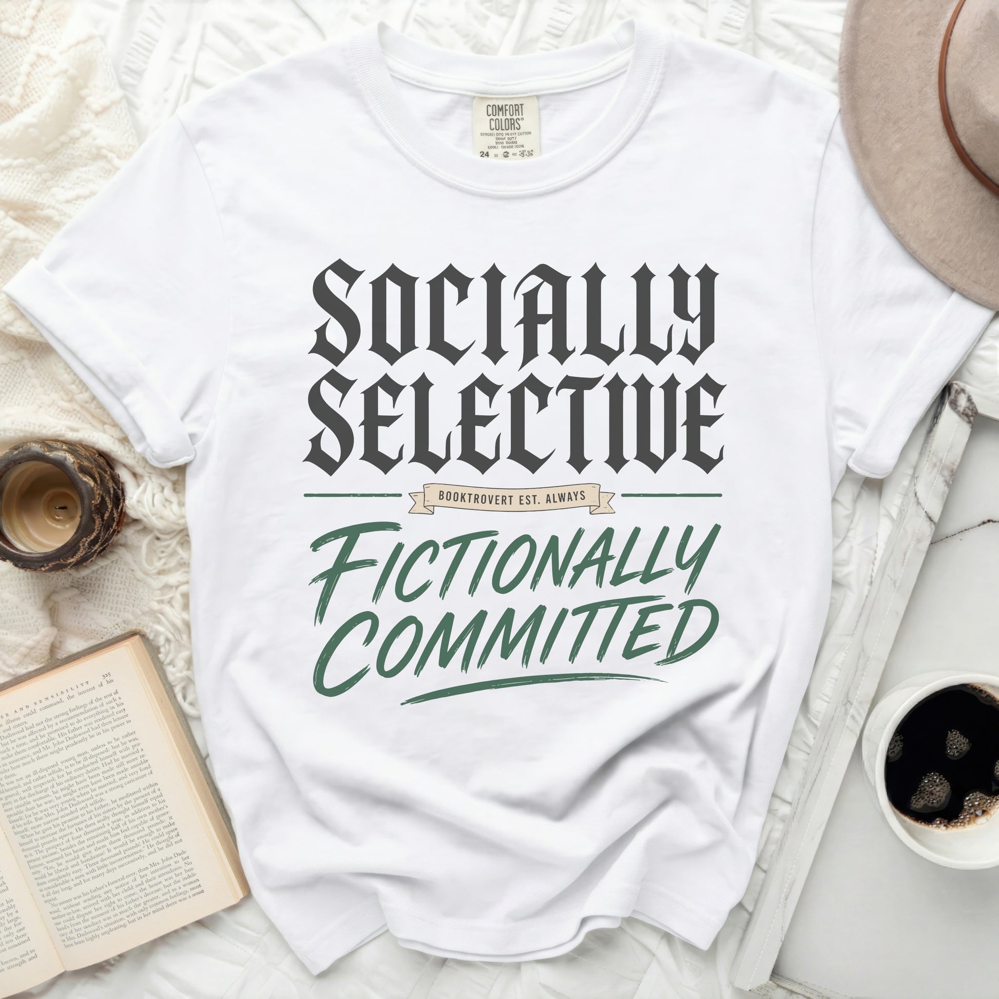 White t-shirt with "Socially Selective, Fictionally Committed" text.