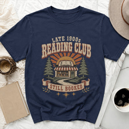 Navy t-shirt with "Late 1900s Reading Club Still Booked" graphic.