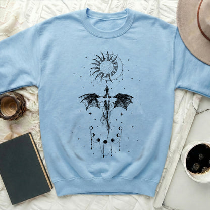 Light blue sweatshirt with a black dragon and celestial graphic design.