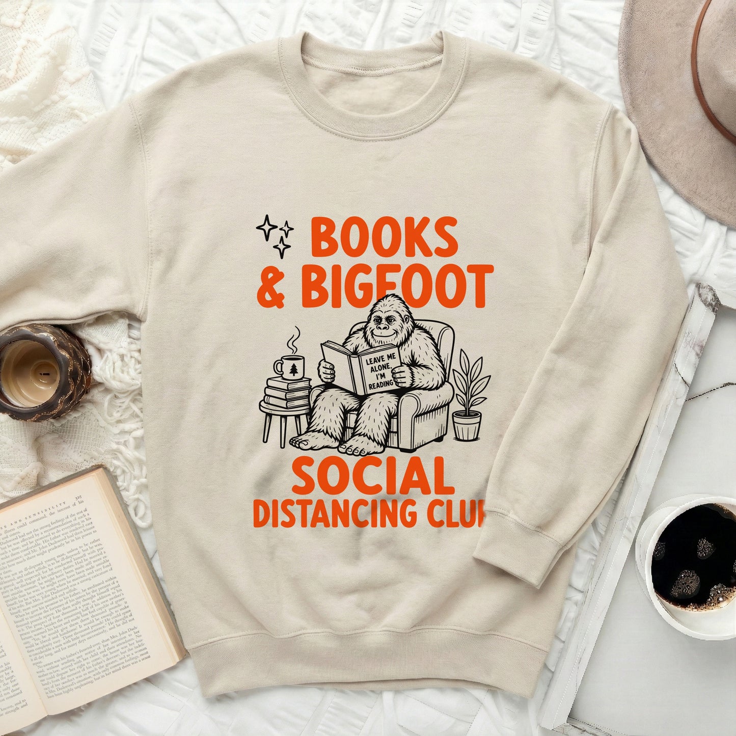 Bigfoot reading a book saying "Leave me alone, I'm reading" with text "Books & Bigfoot Social Distancing Club".