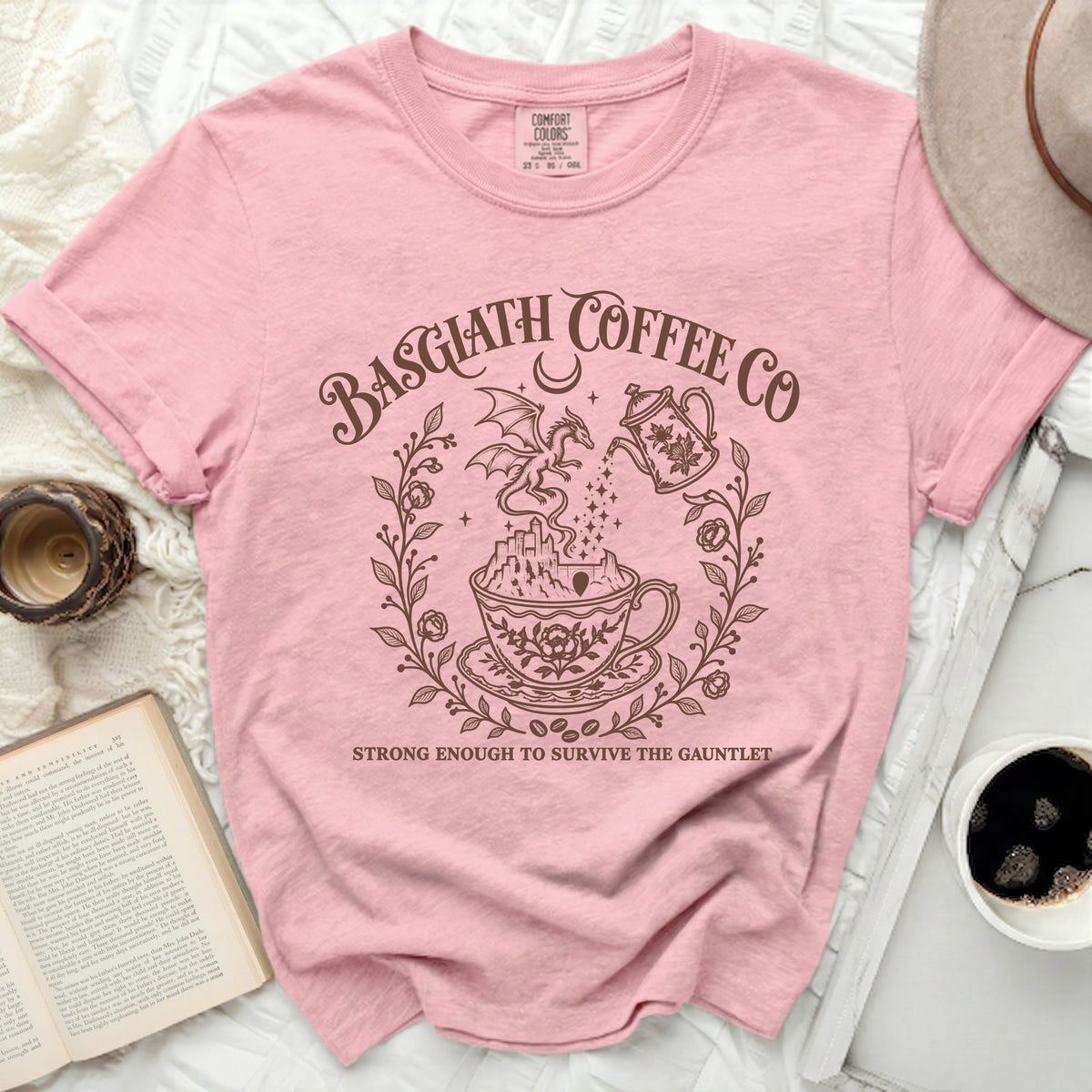 Pink t-shirt with "Basgiath Coffee Co" and dragon design, "Strong Enough to Survive the Gauntlet".