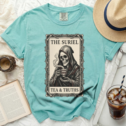 Aqua t-shirt with grim reaper holding cup and text "The Suriel Tea & Truths".