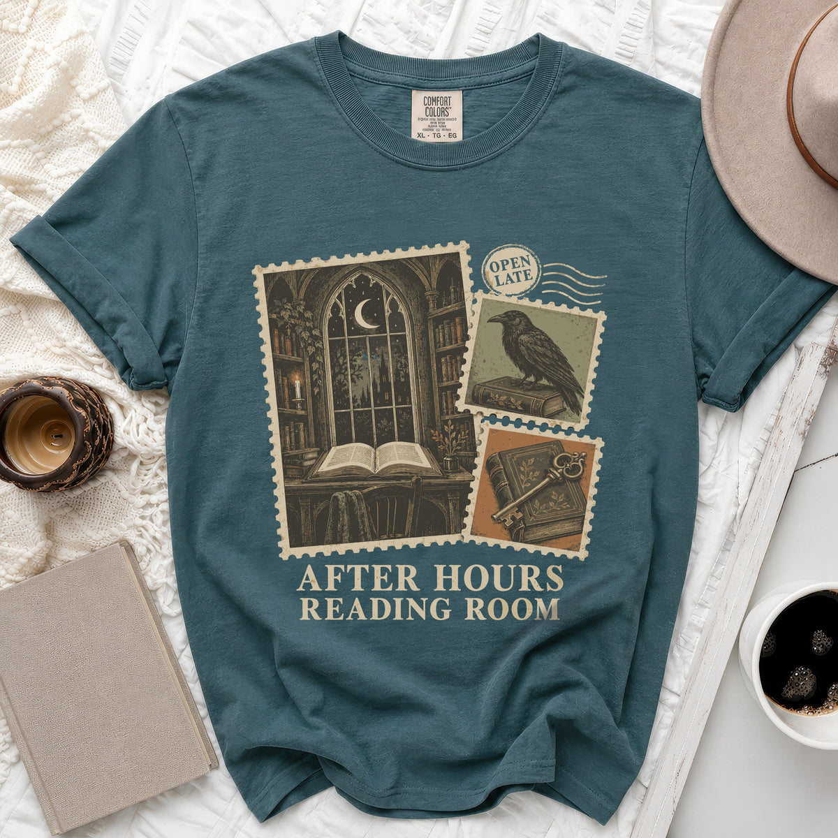 Teal t-shirt with "After Hours Reading Room" graphic of postage stamps.