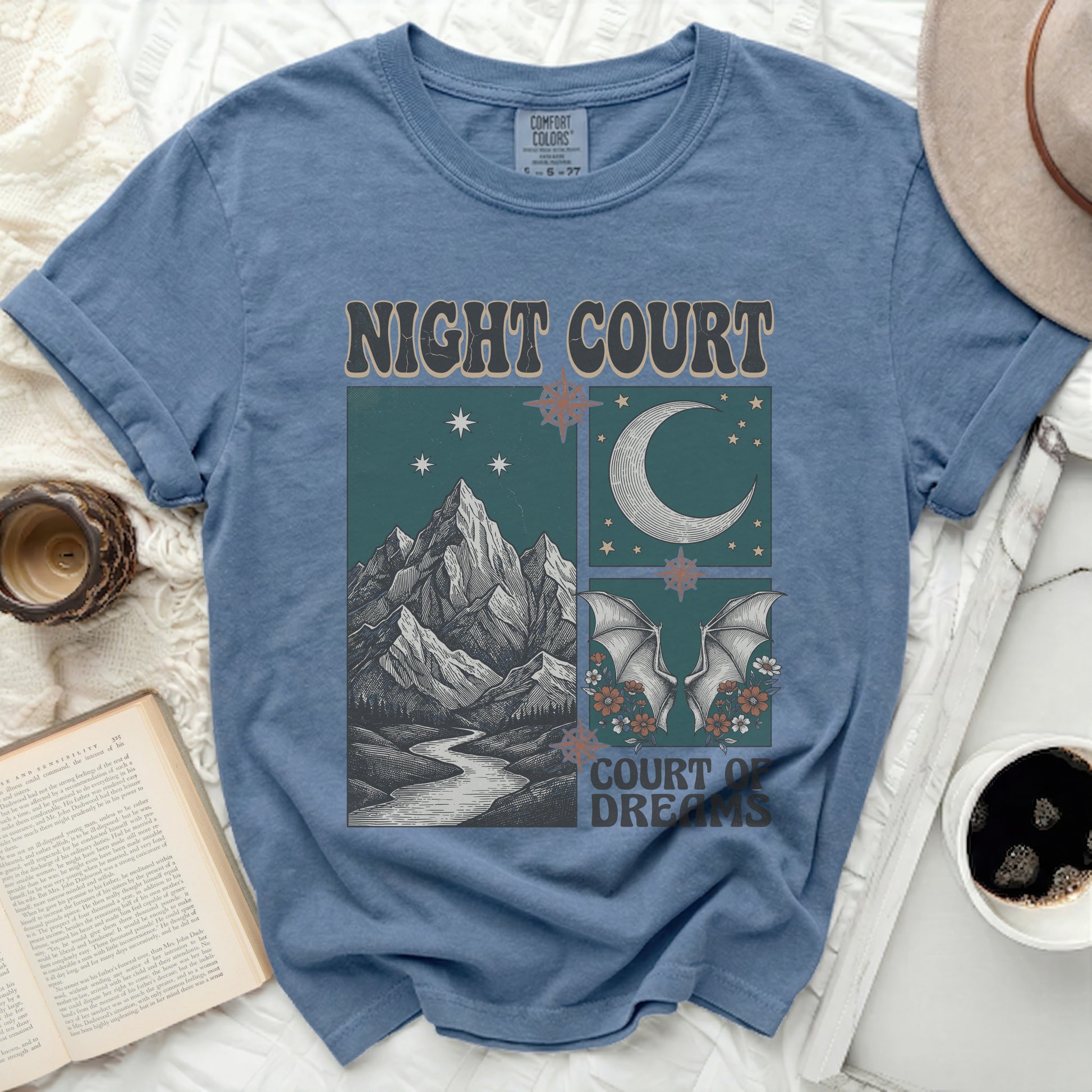 Blue t-shirt with "NIGHT COURT COURT OF DREAMS" graphic of mountains, moon, and bats.