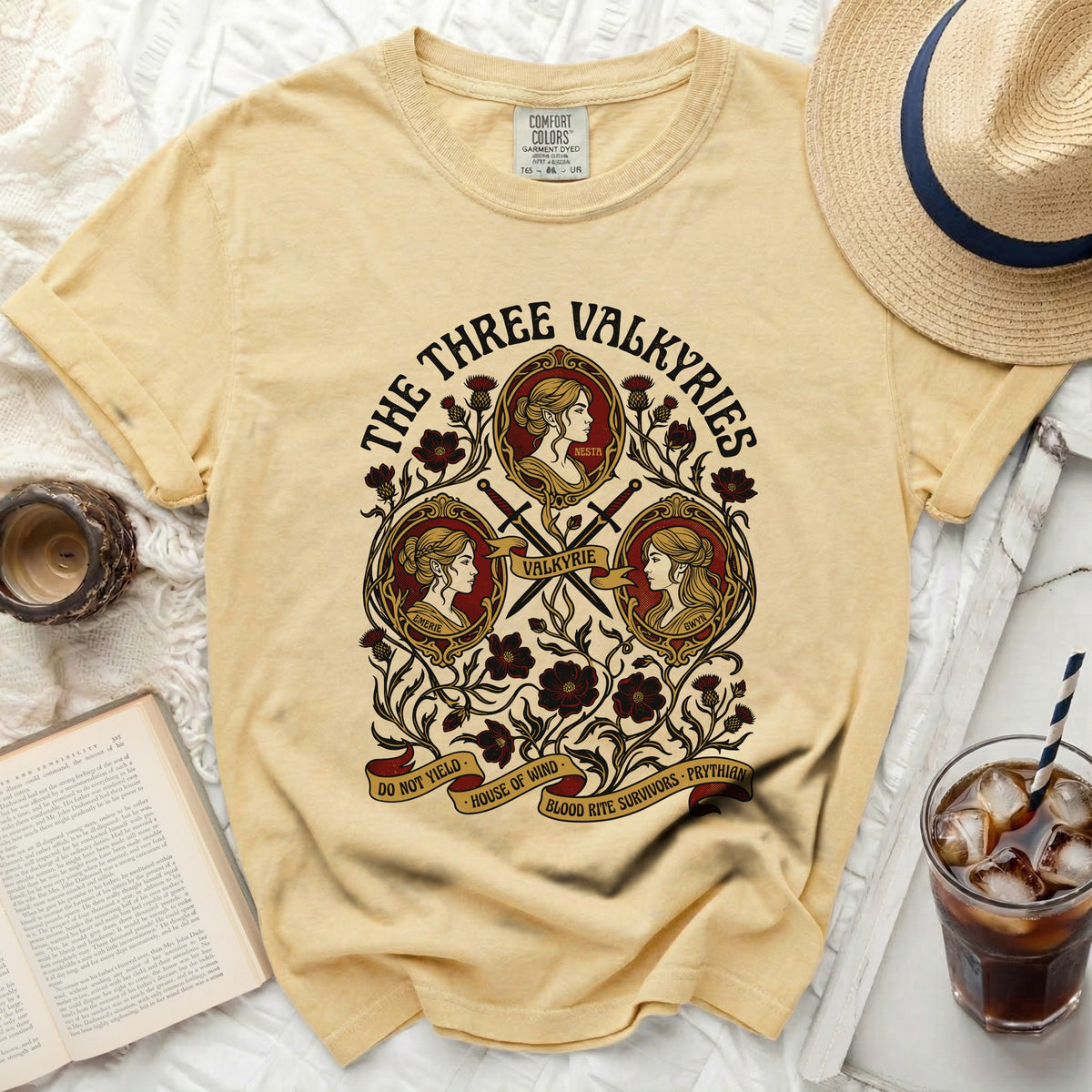 The Three Valkyries t-shirt features three women's profiles and floral motifs.