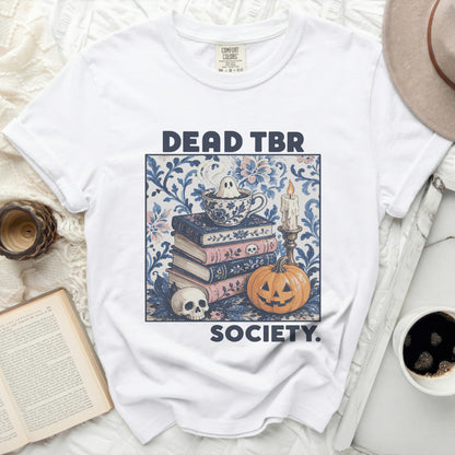White t-shirt with "DEAD TBR SOCIETY" graphic of ghost in teacup.
