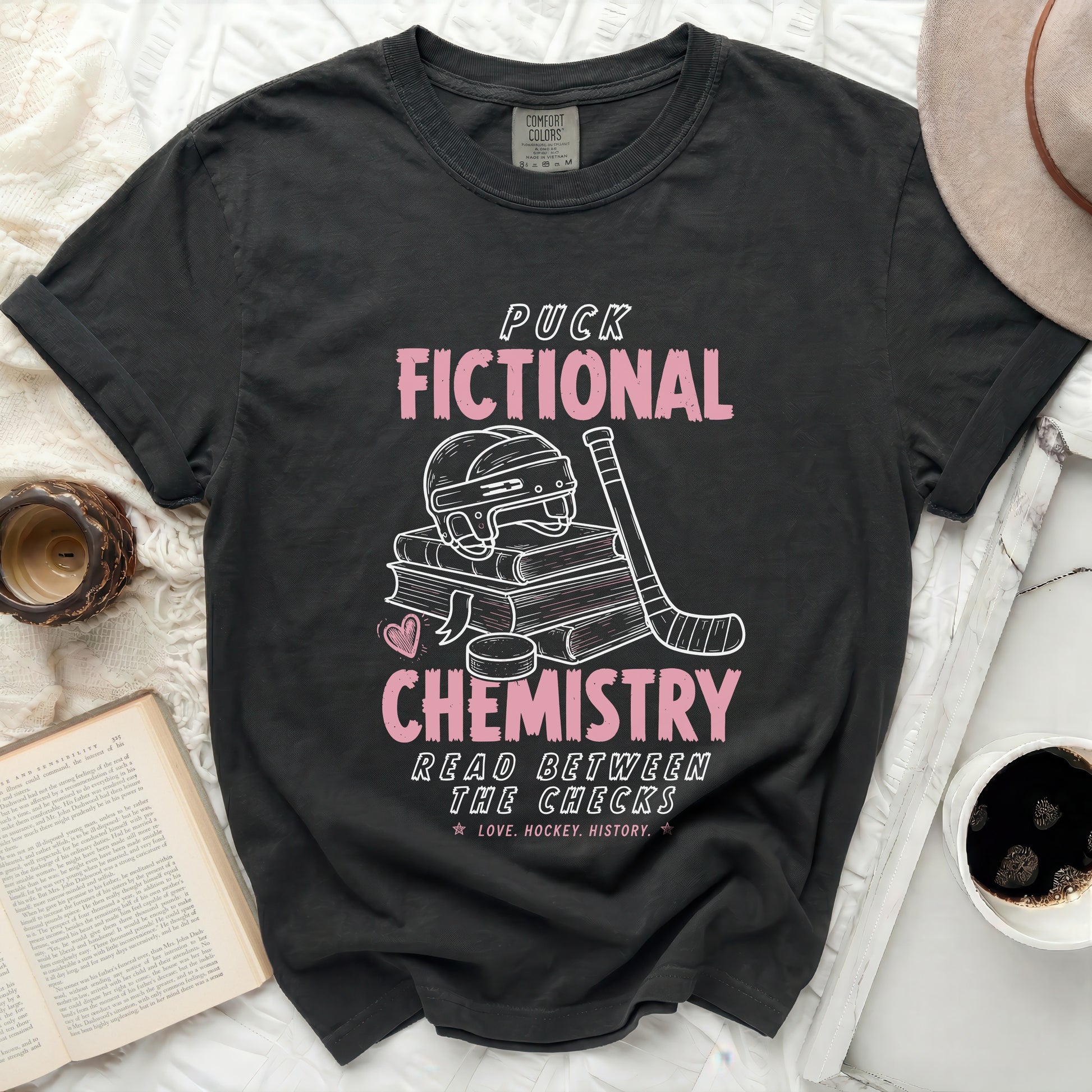 Black t-shirt with "Puck Fictional Chemistry" and hockey graphics.