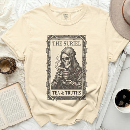 Cream t-shirt with Grim Reaper holding a teacup, reading "The Suriel Tea & Truths".