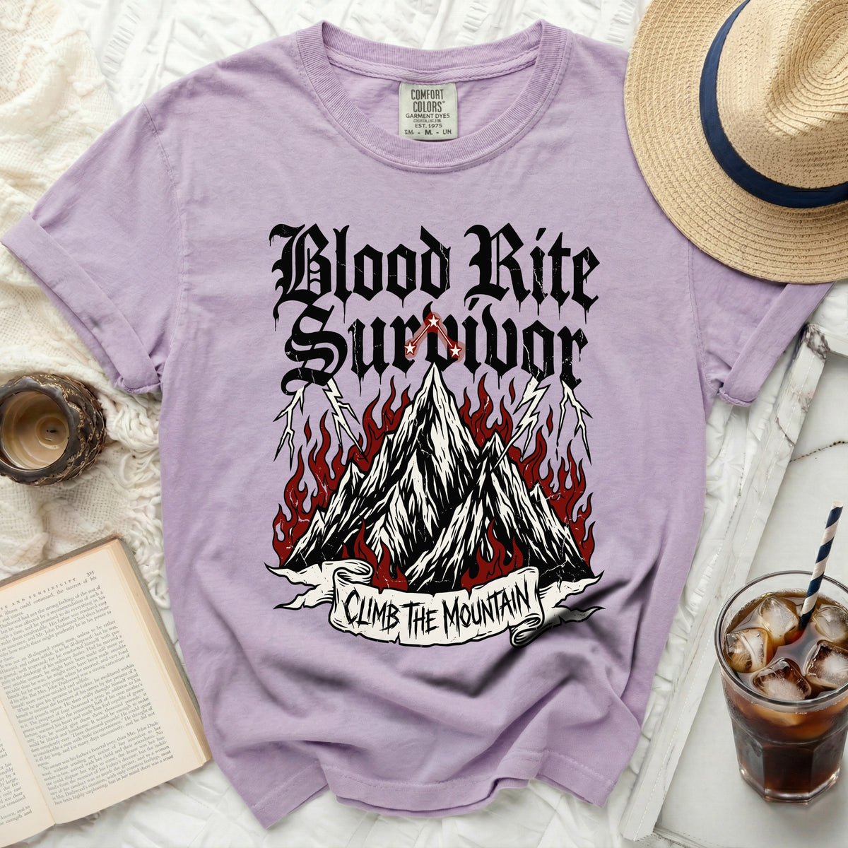 Purple t-shirt with "Blood Rite Survivor" and "Climb The Mountain" graphics.
