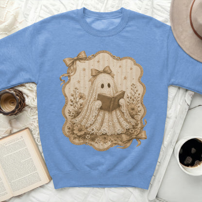 Sweatshirt with illustrated ghost reading a book and surrounded by flowers.