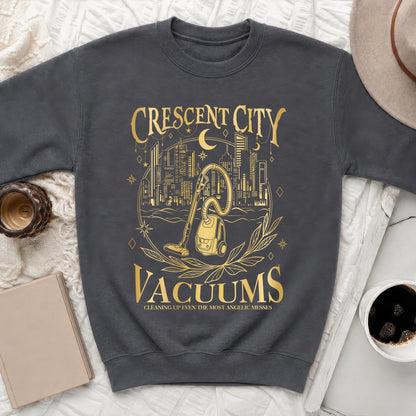 Dark grey sweatshirt with gold "Crescent City Vacuums" and vacuum cleaner graphic.
