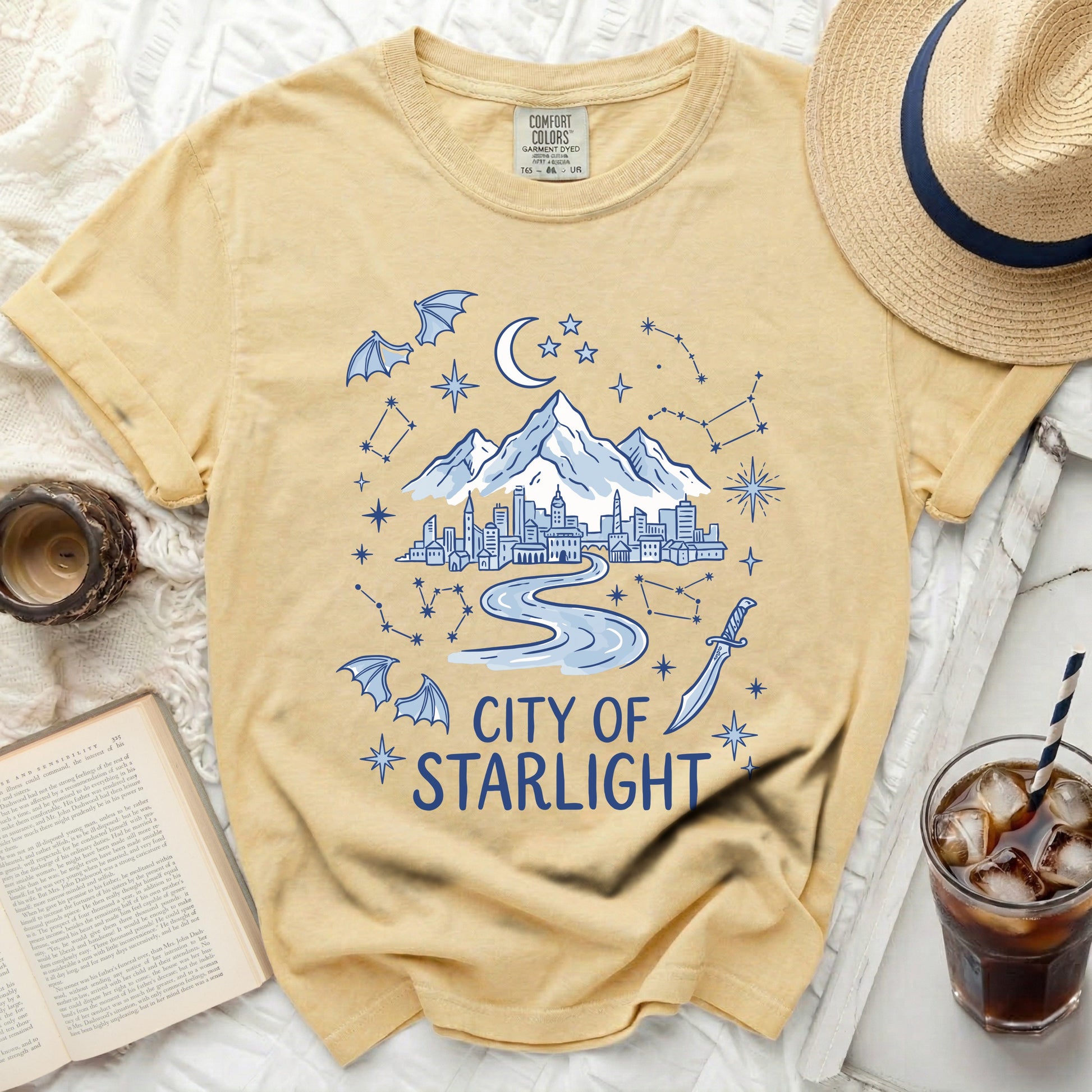 Yellow comfort colors t-shirt with "City of Starlight" graphic.