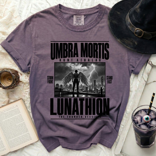 Purple t-shirt with "UMBRA MORTIS LUNATHION" text and winged figure graphic.