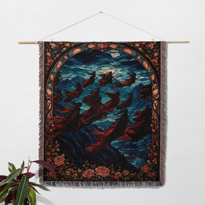 a large tapestry hanging on a wall, depicting a scene with flying figures against a night sky backdrop.