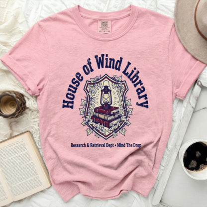Pink t-shirt with "House of Wind Library" and "Research & Retrieval Dept" text.