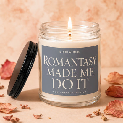 Burning candle with label "DISCLAIMER: ROMANTASY MADE ME DO IT MAGICMERCH...".