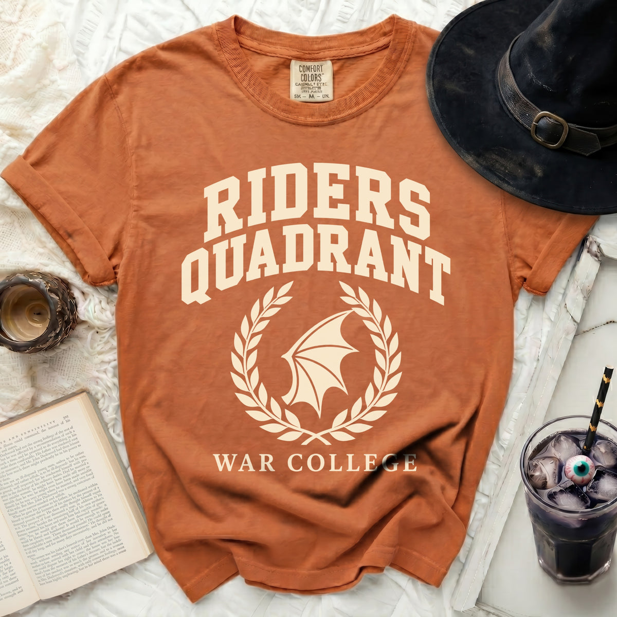 Orange t-shirt with "RIDERS QUADRANT WAR COLLEGE" and bat wing logo.