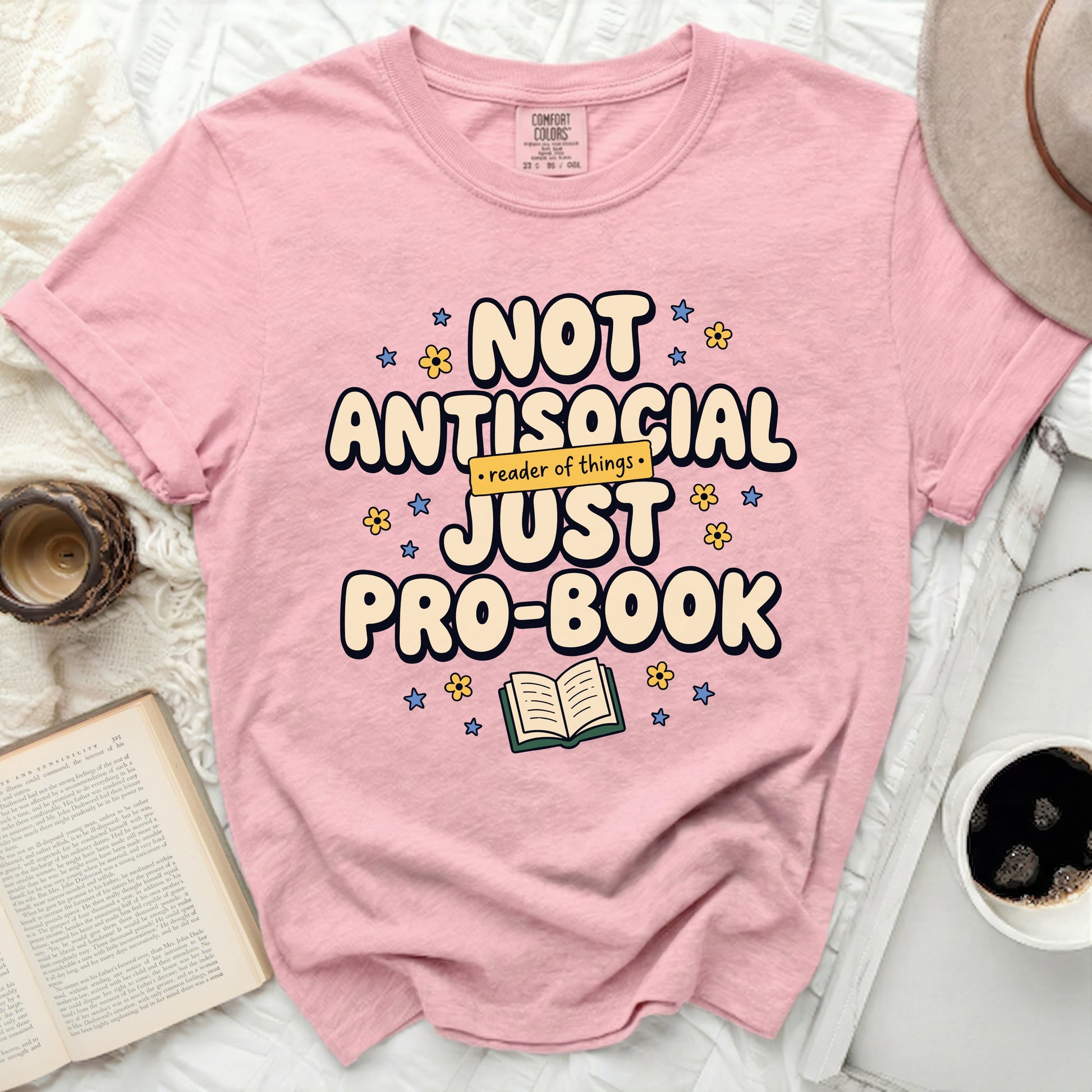 Pink t-shirt with "Not antisocial, just pro-book reader of things." text.