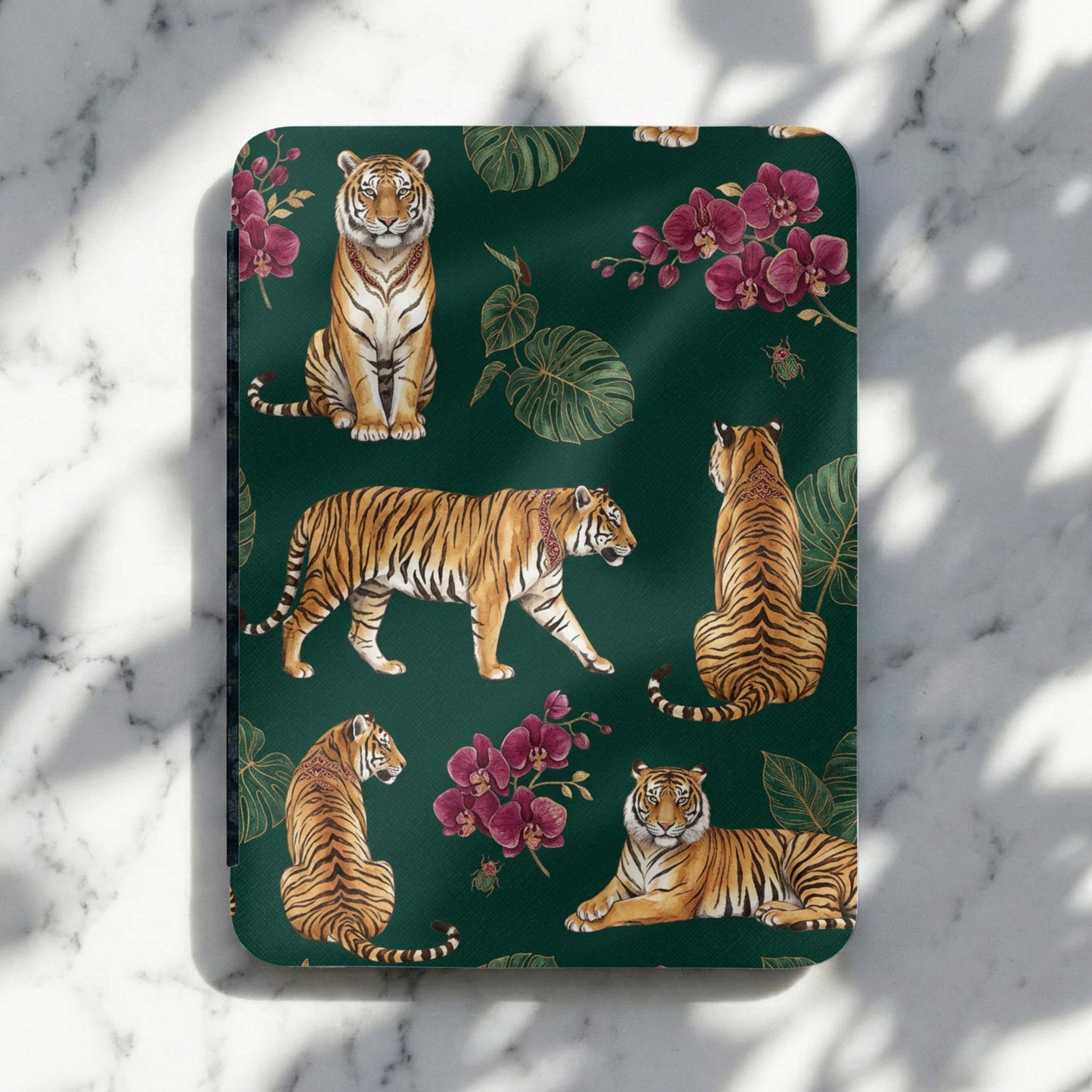 Pattern of tigers, orchids, and leaves on a dark green background.