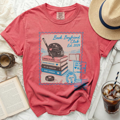 Coral t-shirt with "Book Boyfriend Club Est. 2024" and hockey graphics.