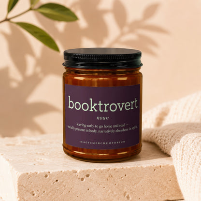 Amber jar candle with "booktrovert" definition label.