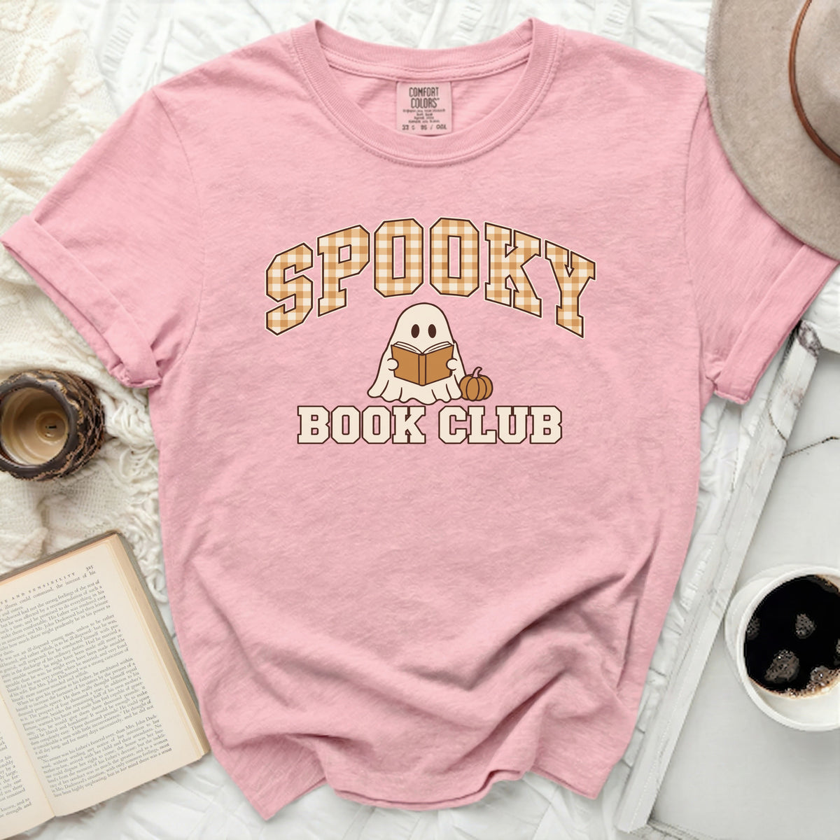Pink t-shirt with "Spooky Book Club" text and ghost graphic.