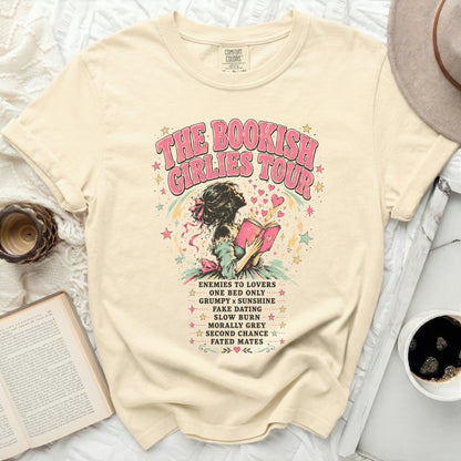 Cream t-shirt with "The Bookish Girlies Tour" text and book-themed quotes.