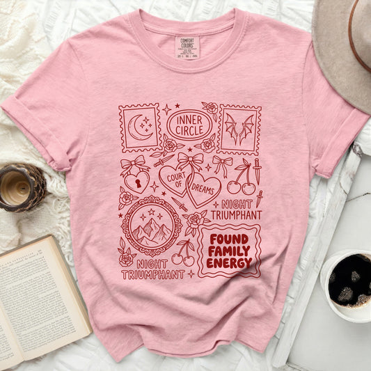 Pink t-shirt with red graphic including "Inner Circle," "Court of Dreams," and "Found Family Energy."
