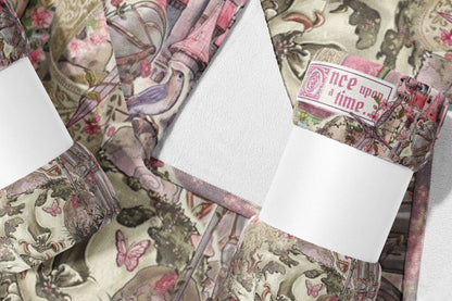 A rolled fabric with a fairytale pattern and the words "once upon a time."
