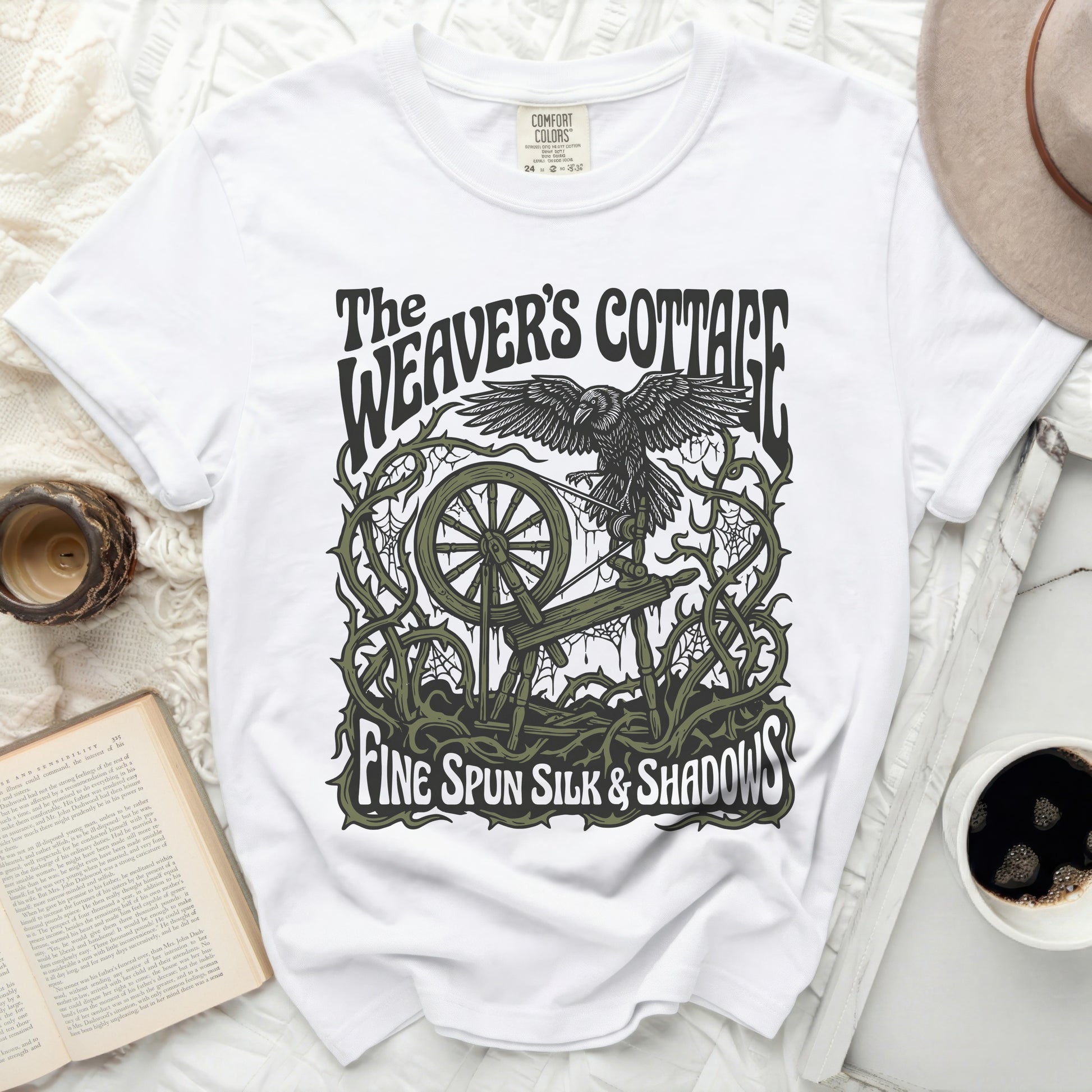 White t-shirt with "The Weaver's Cottage Fine Spun Silk & Shadows" graphic.