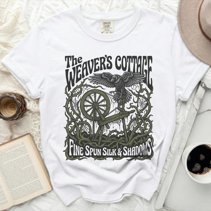 White t-shirt with "The Weaver's Cottage Fine Spun Silk & Shadows" graphic.