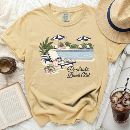 Yellow t-shirt with "Poolside Book Club" design and pool scene.
