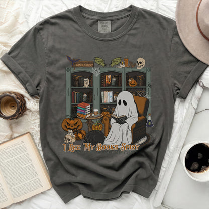 Ghost reading book with Halloween decorations and text "I LIKE MY BOOKS SPICY".