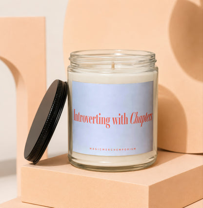 Candle with label text "Introverting with Chapters" and "MAGICMERCHTEMPORIUM".