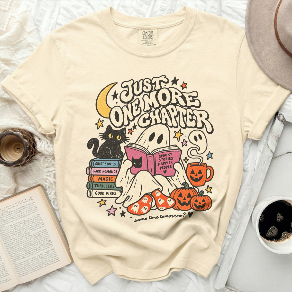 T-shirt with ghost reading "Spooky Stories Happier People" and "Just One More Chapter" text.